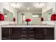 Bathroom features granite counters, and sinks, modern vanity, and two mirrors at 7251 E Portobello Ave, Mesa, AZ 85212