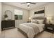 Cozy bedroom with soft lighting, neutral tones, and a comfortable bed at 7251 E Portobello Ave, Mesa, AZ 85212