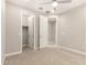 Neutral bedroom featuring a ceiling fan, carpeted floors, and closets for ample storage at 7251 E Portobello Ave, Mesa, AZ 85212