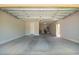 Empty garage featuring painted walls and concrete floors at 7251 E Portobello Ave, Mesa, AZ 85212