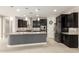Modern kitchen featuring dark cabinetry, granite countertops, stainless steel appliances, and an island at 7251 E Portobello Ave, Mesa, AZ 85212