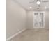 Versatile living space featuring neutral carpet, recessed lighting, and glass French doors at 7251 E Portobello Ave, Mesa, AZ 85212
