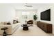Bright living room featuring neutral colors, contemporary furnishings, and ample natural light at 7251 E Portobello Ave, Mesa, AZ 85212