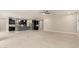 Open-concept living space with carpet, ceiling fan, and adjacent kitchen featuring dark wood cabinetry at 7251 E Portobello Ave, Mesa, AZ 85212
