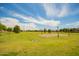 Community volleyball field with well-maintained grass and clear boundaries at 7251 E Portobello Ave, Mesa, AZ 85212
