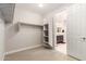 Walk-in closet with shelving, rack and a view to the en-suite bathroom at 7251 E Portobello Ave, Mesa, AZ 85212