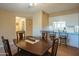 Charming dining area with a wooden table set adjacent to the kitchen and a view of the house at 7436 E Chaparral Rd # B246, Scottsdale, AZ 85250
