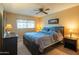 Comfortable main bedroom with a king-size bed, ceiling fan, and a window for natural light at 7436 E Chaparral Rd # B246, Scottsdale, AZ 85250