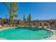 Resort-style pool with lounge chairs and shaded pergola, perfect for relaxation and recreation at 7436 E Chaparral Rd # B246, Scottsdale, AZ 85250
