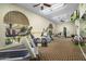 Well-equipped exercise room with modern cardio machines, weight equipment, and natural light at 7512 N Via Camello Del Sur --, Scottsdale, AZ 85258