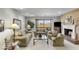 Inviting living room with cozy fireplace and view of the golf course at 7512 N Via Camello Del Sur --, Scottsdale, AZ 85258