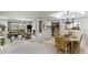 Open-concept living and dining area with golf course views and neutral decor at 7512 N Via Camello Del Sur --, Scottsdale, AZ 85258