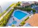 Aerial view of a sparkling swimming pool and jacuzzi surrounded by lush landscaping and lounge chairs at 7512 N Via Camello Del Sur --, Scottsdale, AZ 85258