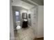 Well-lit bathroom featuring a vanity with stylish fixtures and tile flooring at 8103 E Southern Ave # 279, Mesa, AZ 85209