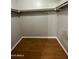 A walk-in closet showcasing ample shelving and stunning wood floors offering a practical and stylish storage solution at 8103 E Southern Ave # 279, Mesa, AZ 85209