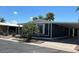Single story home with carport and desert landscaping under a blue sky at 8103 E Southern Ave # 279, Mesa, AZ 85209