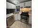 Well-equipped kitchen with stainless steel appliances, ample counter space, and tile flooring at 8103 E Southern Ave # 279, Mesa, AZ 85209