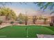 Private backyard with a putting green, desert landscaping, and a serene ambiance at 10335 E Morning Star Dr, Scottsdale, AZ 85255