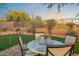 Charming backyard with a putting green, outdoor seating, and lush desert landscaping at 10335 E Morning Star Dr, Scottsdale, AZ 85255