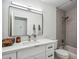 Modern bathroom with a large mirror, sleek vanity, and a shower-tub combination at 10335 E Morning Star Dr, Scottsdale, AZ 85255