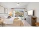 Serene bedroom with a comfortable bed, light-colored walls, and a large window overlooking the backyard at 10335 E Morning Star Dr, Scottsdale, AZ 85255