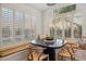 Charming breakfast nook featuring a built-in bench, modern table, and bright natural light from large windows at 10335 E Morning Star Dr, Scottsdale, AZ 85255
