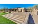 Community building featuring desert landscape with grass, steps, and railings for a modern design at 10335 E Morning Star Dr, Scottsdale, AZ 85255