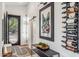 Stylish foyer featuring a unique front door, modern decor, and a wine rack at 10335 E Morning Star Dr, Scottsdale, AZ 85255