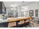 Bright, open-concept kitchen with a large island, modern lighting, and stainless steel appliances at 10335 E Morning Star Dr, Scottsdale, AZ 85255