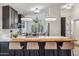 Modern kitchen showcasing dark cabinets, a white marble countertop, and stylish pendant lighting at 10335 E Morning Star Dr, Scottsdale, AZ 85255