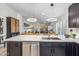 Open kitchen features a large island with bar seating and views into the living room and backyard at 10335 E Morning Star Dr, Scottsdale, AZ 85255