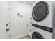 Efficient laundry room featuring a stacked washer and dryer unit, maximizing space at 10335 E Morning Star Dr, Scottsdale, AZ 85255