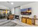 Stylish living room with modern decor, a sleek fireplace, and a TV mounted above a console table at 10335 E Morning Star Dr, Scottsdale, AZ 85255