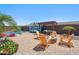 Beautiful backyard with a private pool, an outdoor fire pit, and comfortable seating, perfect for entertaining at 11013 E Decatur St, Mesa, AZ 85207