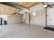 Spacious garage featuring ample storage cabinets and epoxy flooring at 11013 E Decatur St, Mesa, AZ 85207