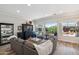 Bright living room with views of the pool and backyard, and ample seating at 11013 E Decatur St, Mesa, AZ 85207