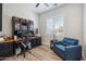 Well-lit office space with built-in desk, storage, and a comfortable chair, perfect for productivity at 11013 E Decatur St, Mesa, AZ 85207