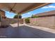 Private backyard with desert landscaping, tiled patio, and fire pit, perfect for entertaining at 11040 E Nichols Ave, Mesa, AZ 85209