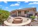 Charming backyard with a cozy fire pit area, perfect for outdoor entertaining and relaxation at 11040 E Nichols Ave, Mesa, AZ 85209
