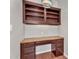 Close-up of the bedroom desk and shelves with wood laminate flooring at 11040 E Nichols Ave, Mesa, AZ 85209