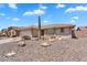 Charming home features a desert landscape with rocks, cactus, and a neutral color palette at 11040 E Nichols Ave, Mesa, AZ 85209