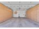 Spacious garage with ample storage cabinets lining the walls, providing plenty of room for vehicles and equipment at 11040 E Nichols Ave, Mesa, AZ 85209