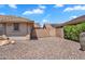 Gated side yard features desert landscaping, block wall, and access to the home at 11040 E Nichols Ave, Mesa, AZ 85209