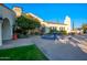 Beautiful clubhouse featuring a blue tiled fountain and lush landscaping at 12820 W La Vina Dr, Sun City West, AZ 85375