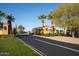 Exclusive gated community entrance featuring lush landscaping and architectural details at 12820 W La Vina Dr, Sun City West, AZ 85375