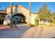 Elegant golf clubhouse with manicured landscaping and a welcoming entrance at 12820 W La Vina Dr, Sun City West, AZ 85375