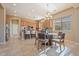 Bright eat-in kitchen features granite countertops, stainless appliances, and tile floors at 12820 W La Vina Dr, Sun City West, AZ 85375