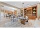 Open-concept living space with seamless flow between kitchen, dining, and sitting areas is perfect for entertaining at 12820 W La Vina Dr, Sun City West, AZ 85375