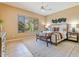 Serene main bedroom featuring neutral colors, a large window, and stylish furnishings at 12820 W La Vina Dr, Sun City West, AZ 85375
