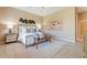 Comfortable main bedroom featuring neutral walls, a ceiling fan, and ample natural light at 12820 W La Vina Dr, Sun City West, AZ 85375